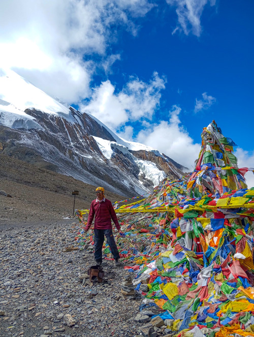 Guy cliclking picture on Thorong La Pass