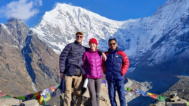 Trekkers clicking picture in front of Langtang Himal